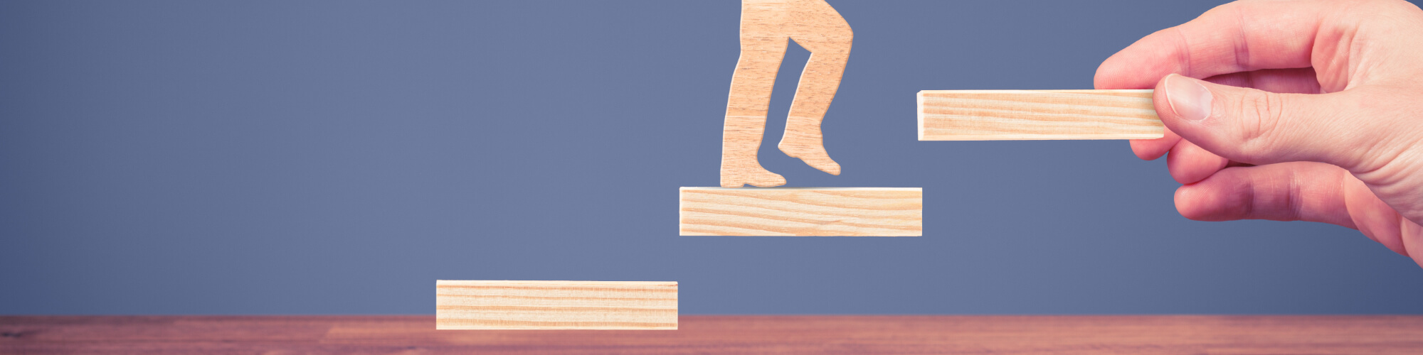 figure walking up wooden block stairs 